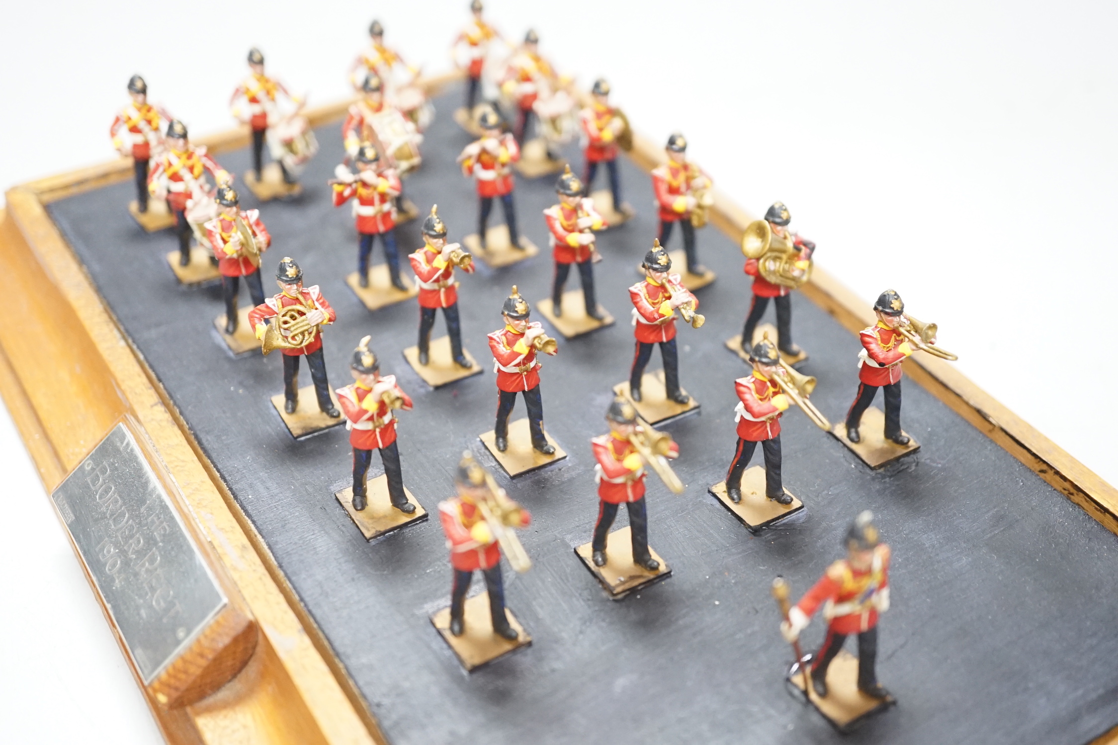 A group of painted lead soldiers, depicting the Border Regiment 1904